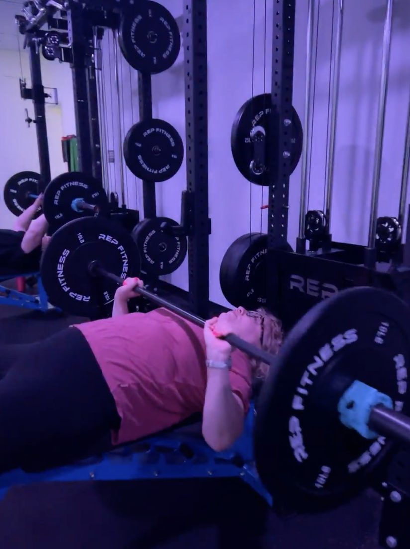 Member bench pressing at Thrive&rsquo;s Lincoln Street strength studio